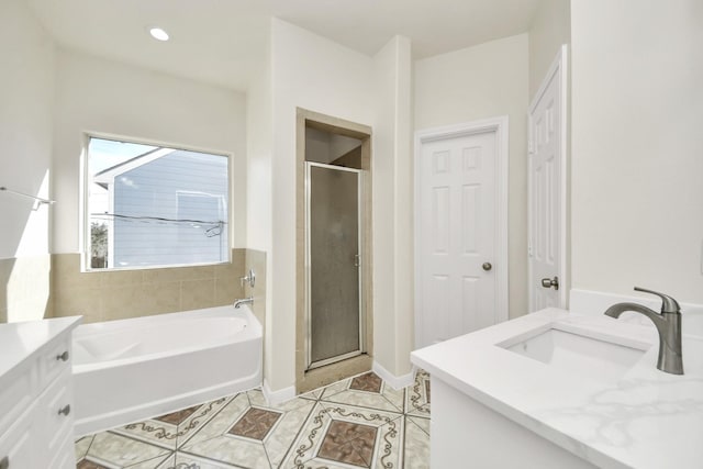 bathroom featuring vanity, tile patterned flooring, and independent shower and bath