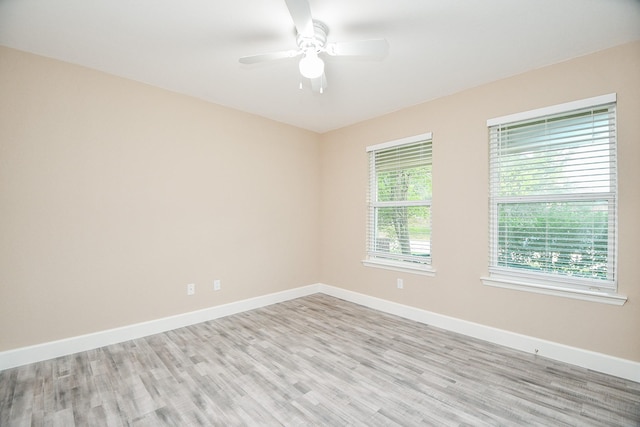 unfurnished room with ceiling fan and light hardwood / wood-style floors