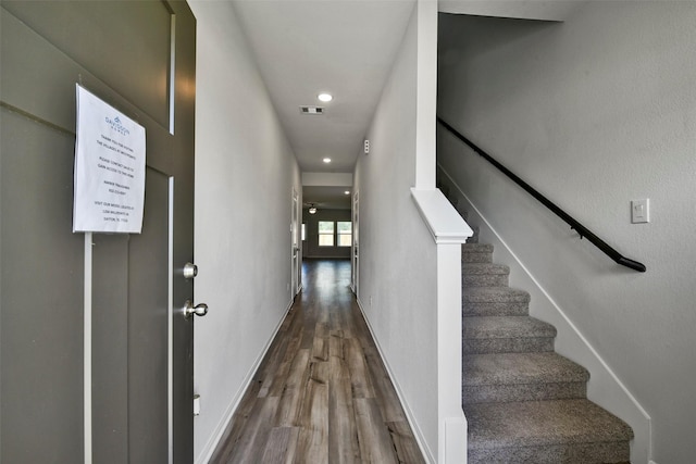 staircase featuring hardwood / wood-style floors