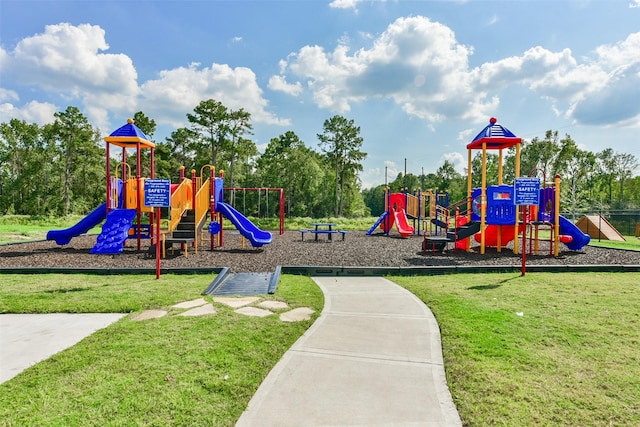 view of playground featuring a lawn