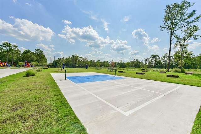 view of sport court featuring a yard and a playground