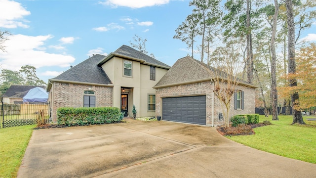 view of front of property with a garage and a front yard