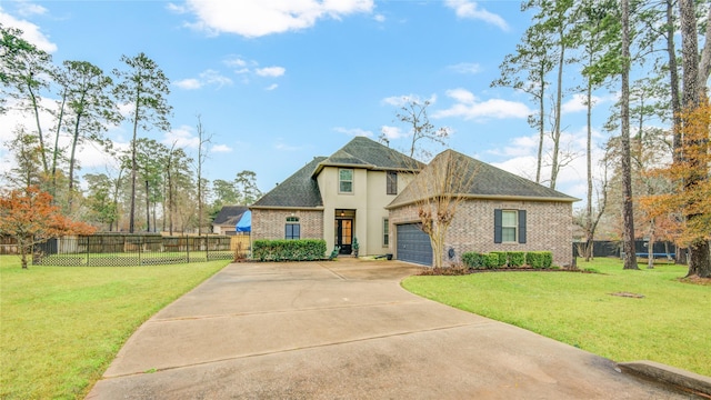 view of front of home featuring a garage and a front lawn