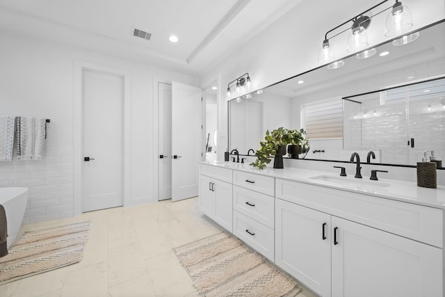 bathroom featuring vanity, tile walls, and plus walk in shower