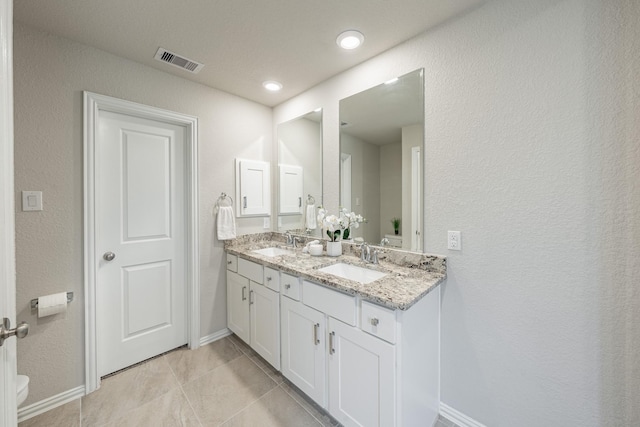 bathroom featuring vanity and tile patterned flooring