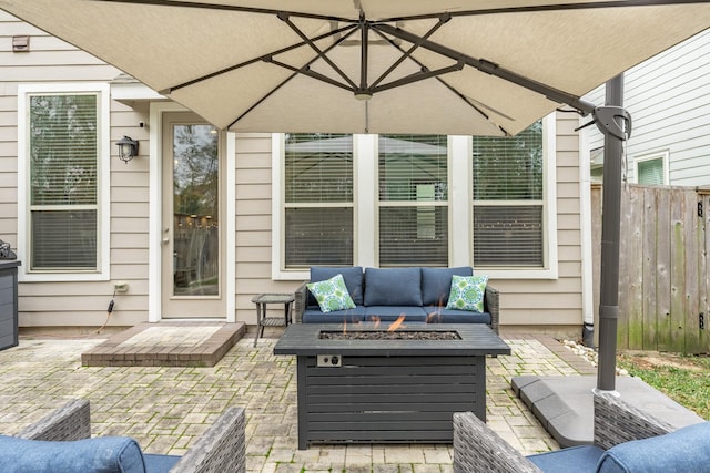 view of patio / terrace featuring an outdoor living space with a fire pit