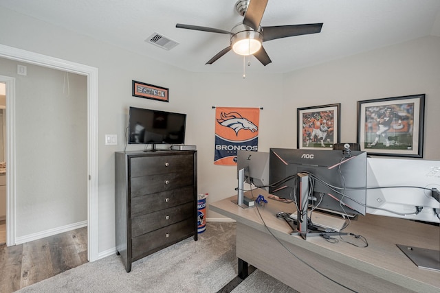 office area with ceiling fan and hardwood / wood-style floors