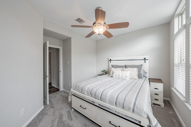 bedroom with light carpet and ceiling fan