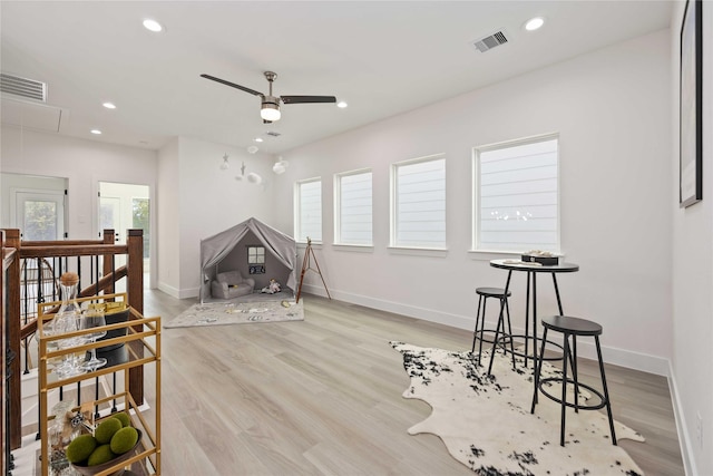 interior space featuring light hardwood / wood-style flooring and ceiling fan