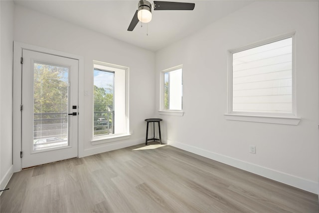 spare room with light hardwood / wood-style flooring and ceiling fan