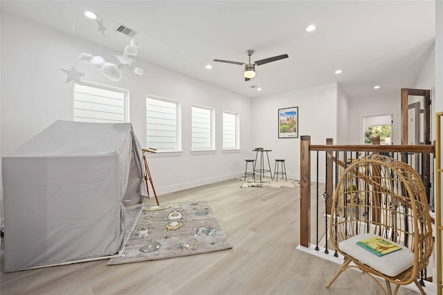 interior space featuring plenty of natural light, light hardwood / wood-style floors, and ceiling fan