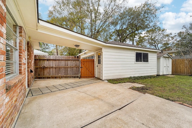 view of patio / terrace featuring a storage shed