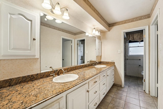 bathroom featuring tile patterned floors, vanity, and toilet