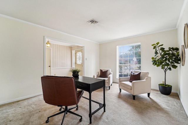 office area with ornamental molding and light carpet