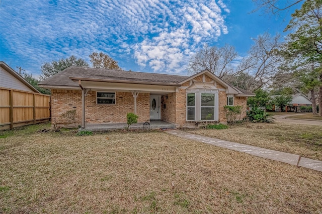 view of front facade with a front yard and a porch