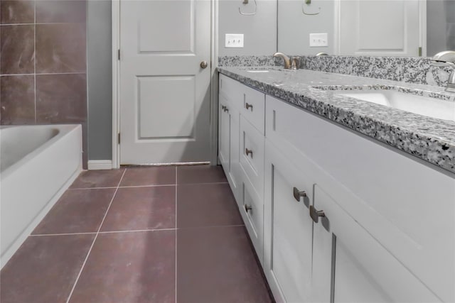 bathroom with tile patterned flooring and vanity