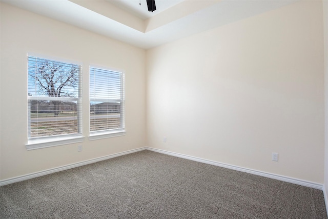 carpeted empty room featuring ceiling fan