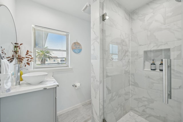 bathroom featuring vanity and a tile shower