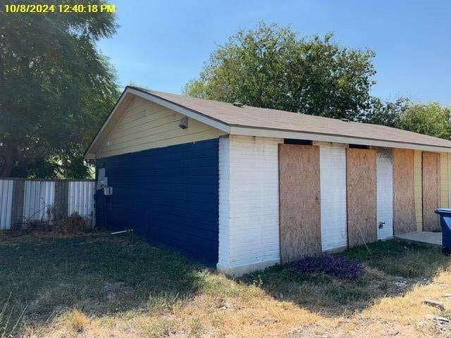 garage with a lawn