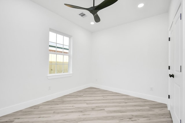 empty room with light hardwood / wood-style flooring and ceiling fan