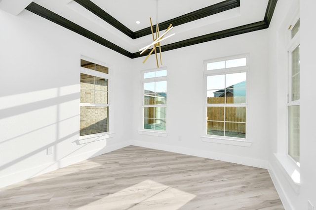 unfurnished dining area with crown molding and light wood-type flooring