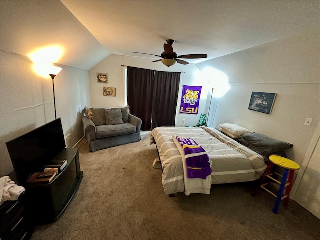 bedroom with vaulted ceiling, ceiling fan, and carpet flooring