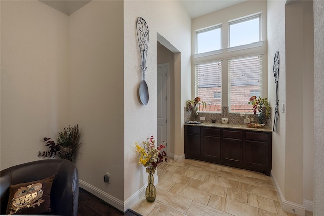 bathroom with vanity and decorative backsplash