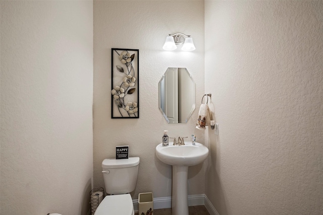 bathroom with sink and toilet