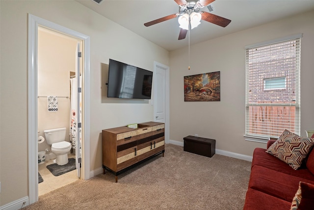 living room with light colored carpet and ceiling fan