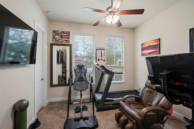 exercise area featuring carpet floors and ceiling fan