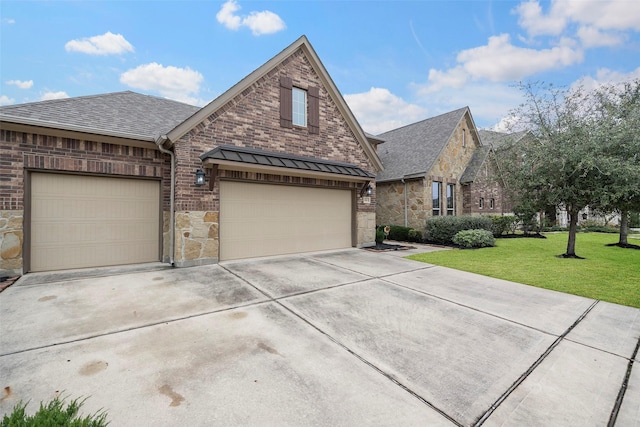 view of front of house featuring a garage and a front yard