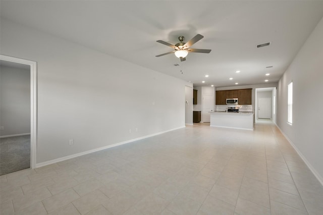 1312 Cypress Ln, Dayton, TX 77535 - unfurnished living room with a ceiling fan and recessed lighting
