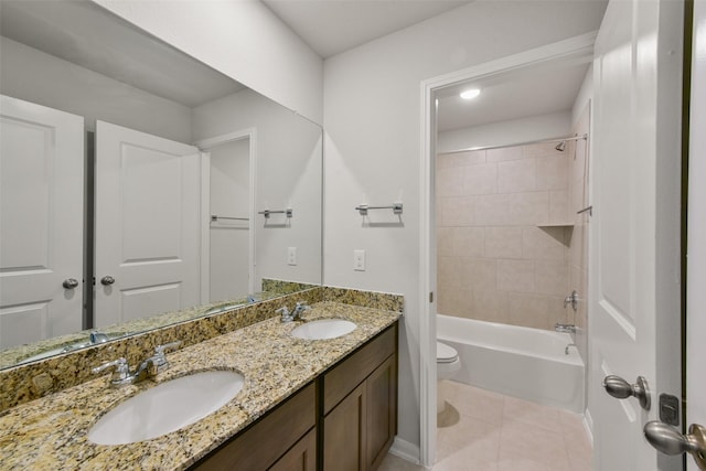 1312 Cypress Ln, Dayton, TX 77535 - bathroom featuring double vanity, tile patterned flooring, and washtub / shower combination