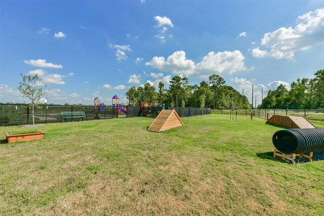 1312 Cypress Ln, Dayton, TX 77535 - view of yard with a dog friendly area