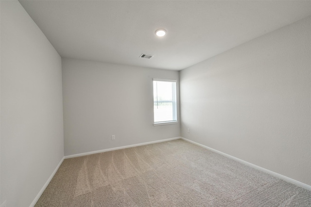 1312 Cypress Ln, Dayton, TX 77535 - spare room featuring baseboards and light colored carpet