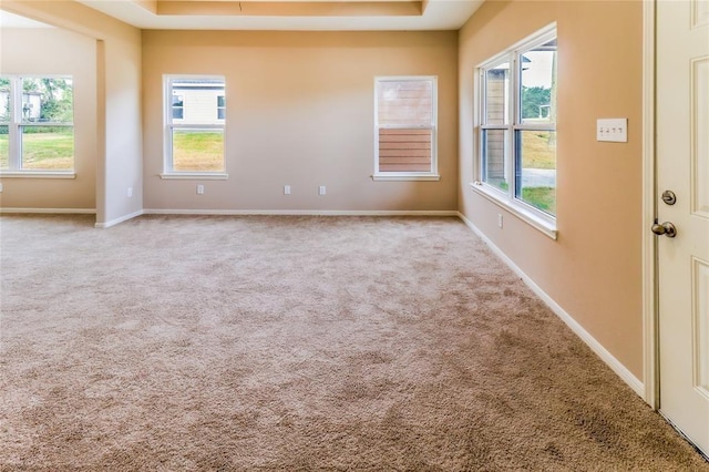 empty room featuring light colored carpet