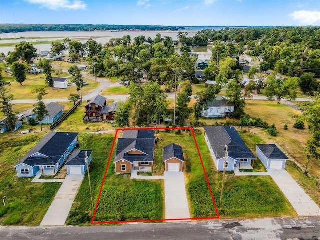 bird's eye view featuring a water view and a residential view