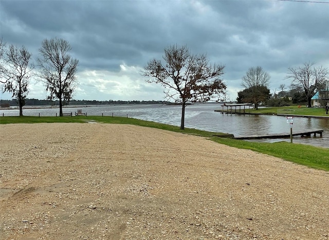 property view of water featuring a boat dock