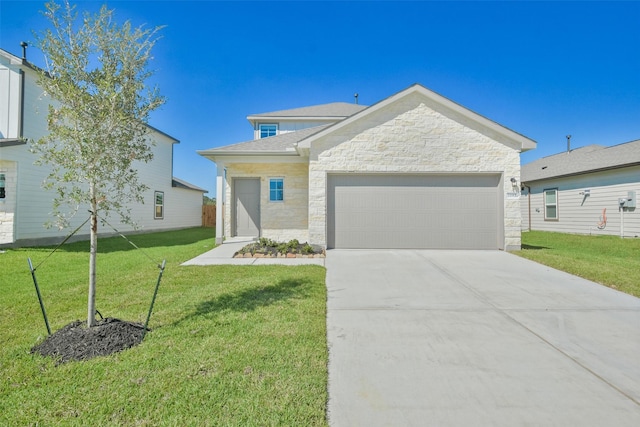 view of front facade with a garage and a front lawn