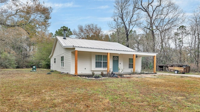 view of front of home featuring covered porch and a front yard