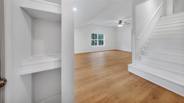 unfurnished living room featuring hardwood / wood-style floors and ceiling fan