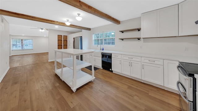 kitchen with beamed ceiling, sink, white cabinets, light hardwood / wood-style floors, and stainless steel appliances