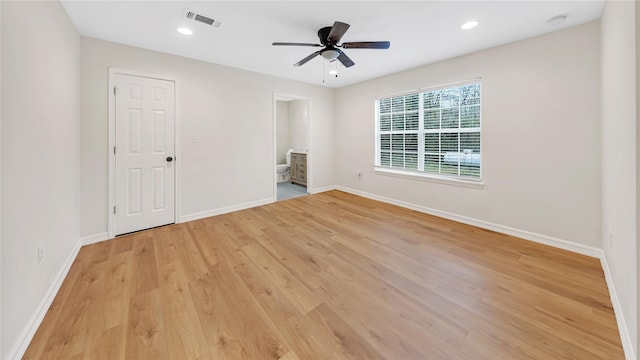 spare room with light hardwood / wood-style flooring and ceiling fan