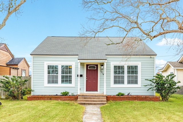 view of front of home with a front lawn