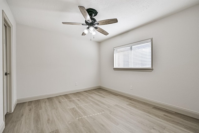 spare room with ceiling fan and light hardwood / wood-style floors