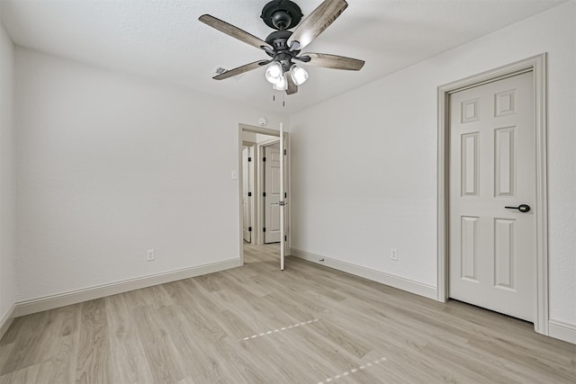 unfurnished bedroom featuring light hardwood / wood-style flooring and ceiling fan