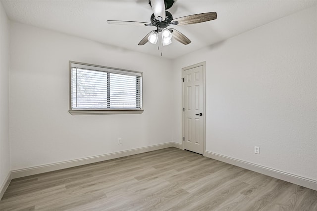 unfurnished room featuring ceiling fan and light hardwood / wood-style flooring