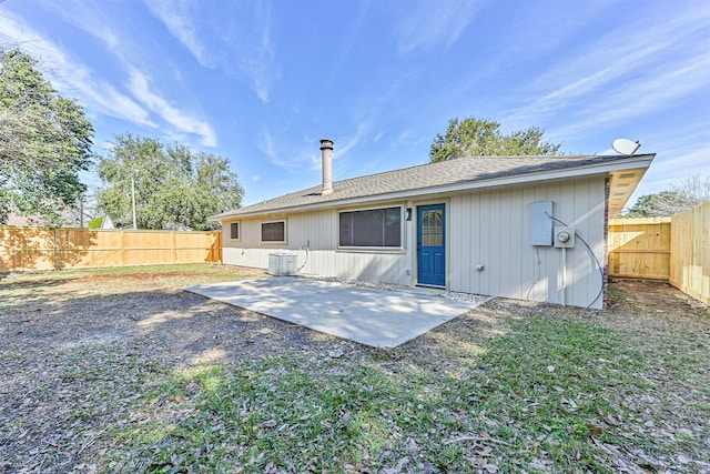 back of house with a patio, a yard, and cooling unit