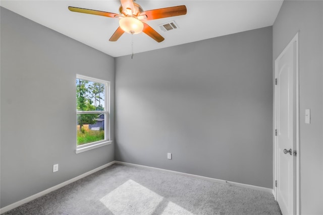 empty room featuring baseboards, visible vents, ceiling fan, and carpet flooring