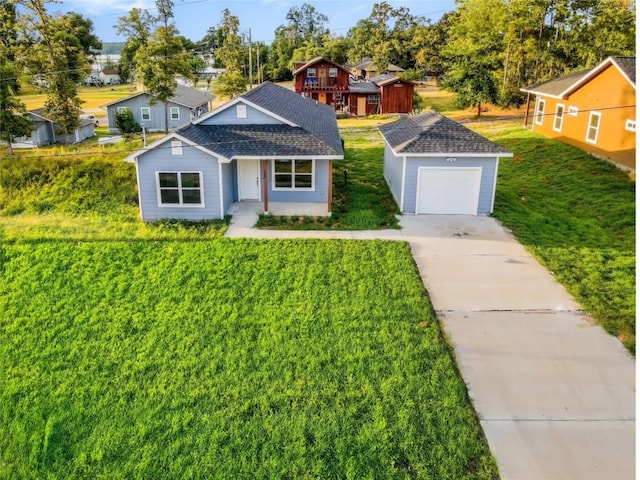 view of front of house featuring a garage and a front yard